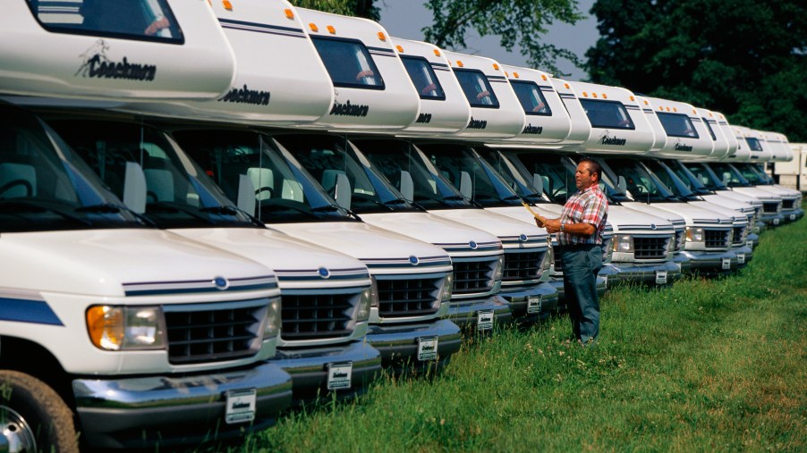 A worker logs in Coachmen RVs outside the company's factory in Goshen, Indiana, in 1996
