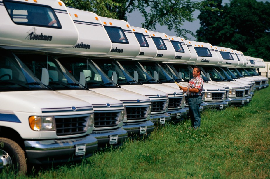 A worker logs in Coachmen RVs outside the company's factory in Goshen, Indiana, in 1996