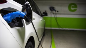 An electric vehicle plugged in to charge