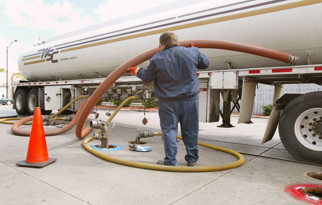 A tanker truck delivers gasoline to a gas station  | Tim Boyle/Getty Images
