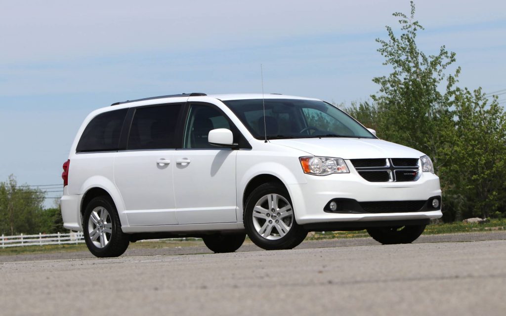 White Dodge Caravan front 3/4 view