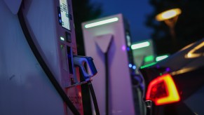 An electric vehicle charging station lights up at night