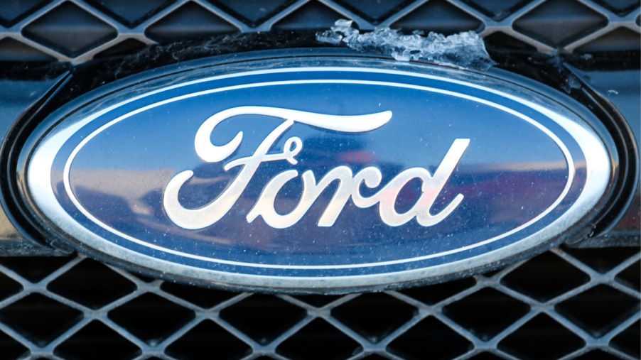 A Ford logo on the front grille of an Explorer