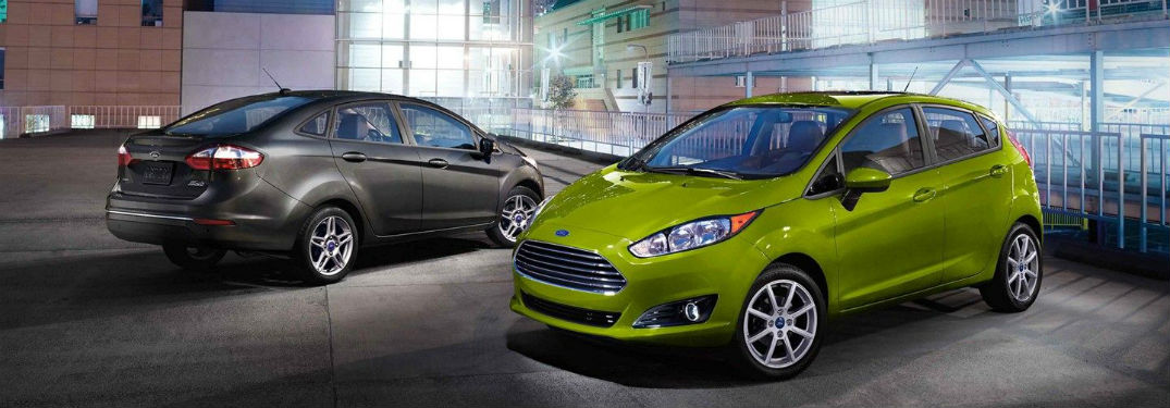 Gray Ford Fiesta sedan and green hatchback