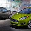 Gray Ford Fiesta sedan and green hatchback