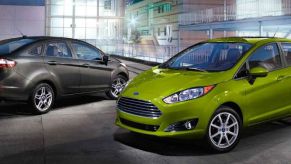 Gray Ford Fiesta sedan and green hatchback