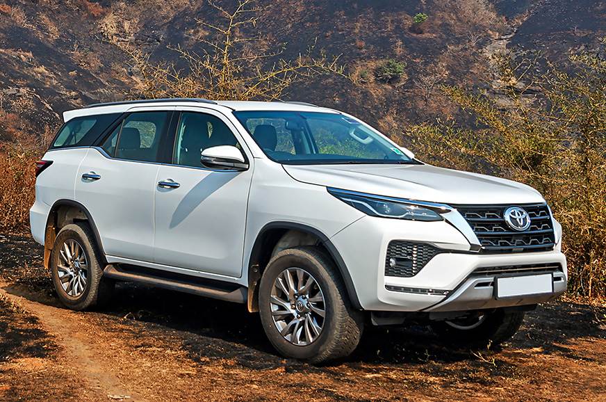 The 2021 Toyota Fortuner driving on a dirt road