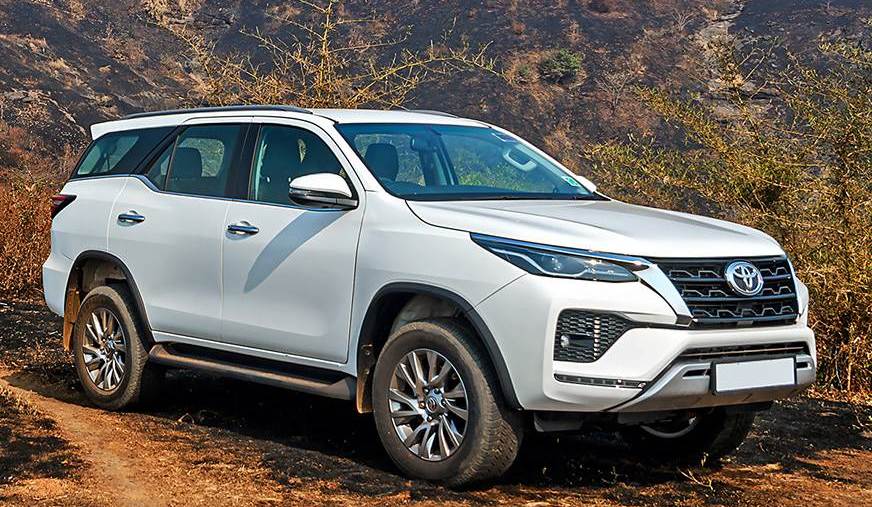The 2021 Toyota Fortuner driving on a dirt road