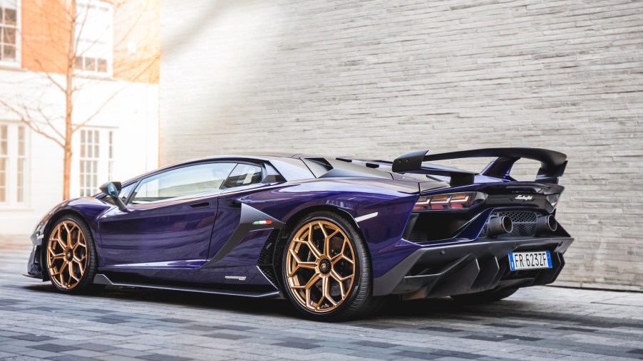 An image of a Lamborghini Aventador SVJ parked outdoors in one of the worst car colors for resale value.