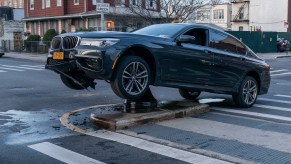 An image of a crashed car out on the road.