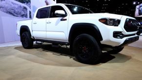 a white 2017 Toyota Tacoma trd pro on display at an auto show