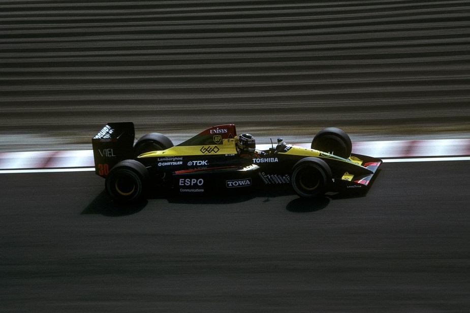 An image of a Lamborghini-powered Formula 1 car out on a track.
