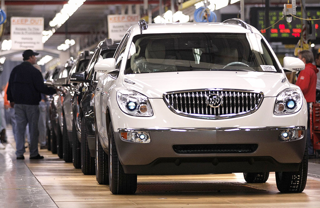 a GM assembly line with new Buick models in a line, almost complete. 