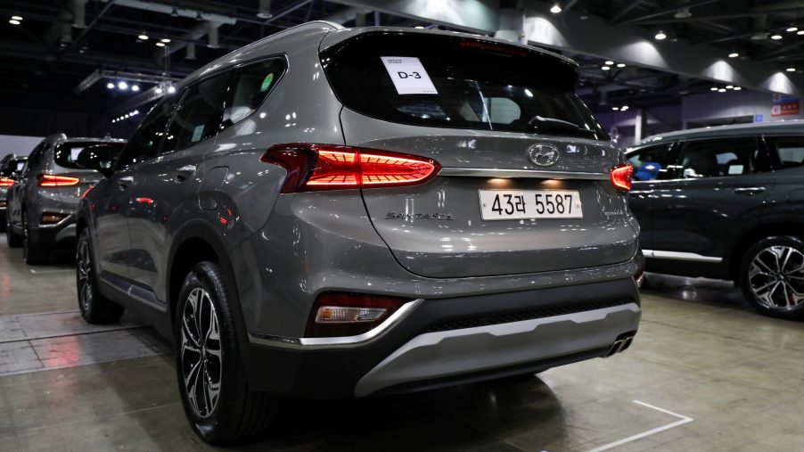 A gray Hyundai Motor Co. Santa Fe sport utility vehicle (SUV) stands on display during a launch event for the updated vehicle
