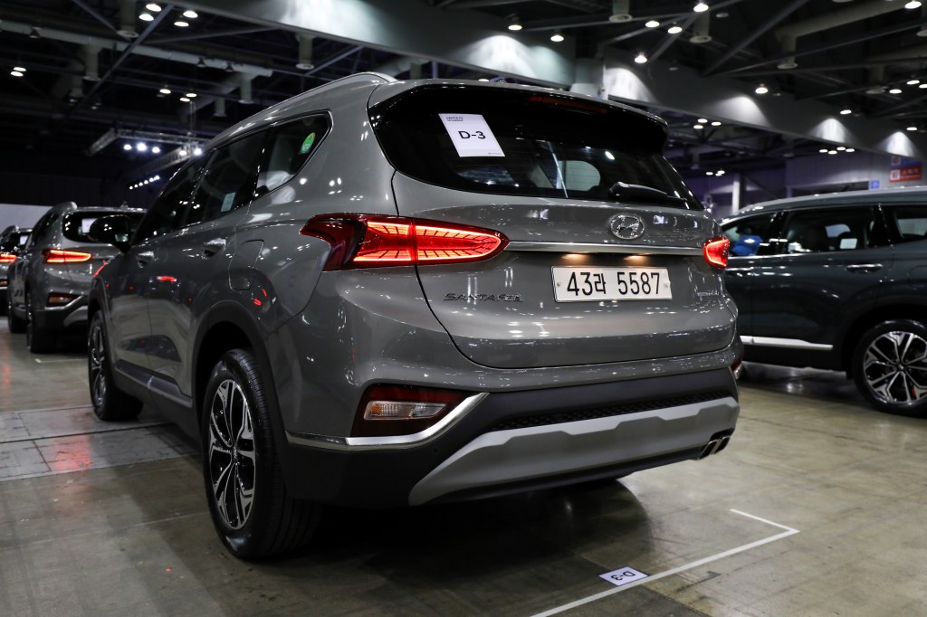 A gray Hyundai Motor Co. Santa Fe sport utility vehicle (SUV) stands on display during a launch event for the updated vehicle
