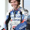 Guy Martin in a blue-white-and-red BMW-branded leather racing suit at the 2013 Cemetery Circuit Motorcycle Races in New Zealand