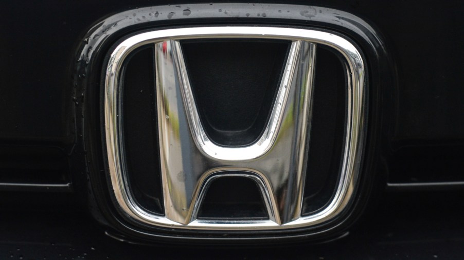 The Honda log on the front of a car
