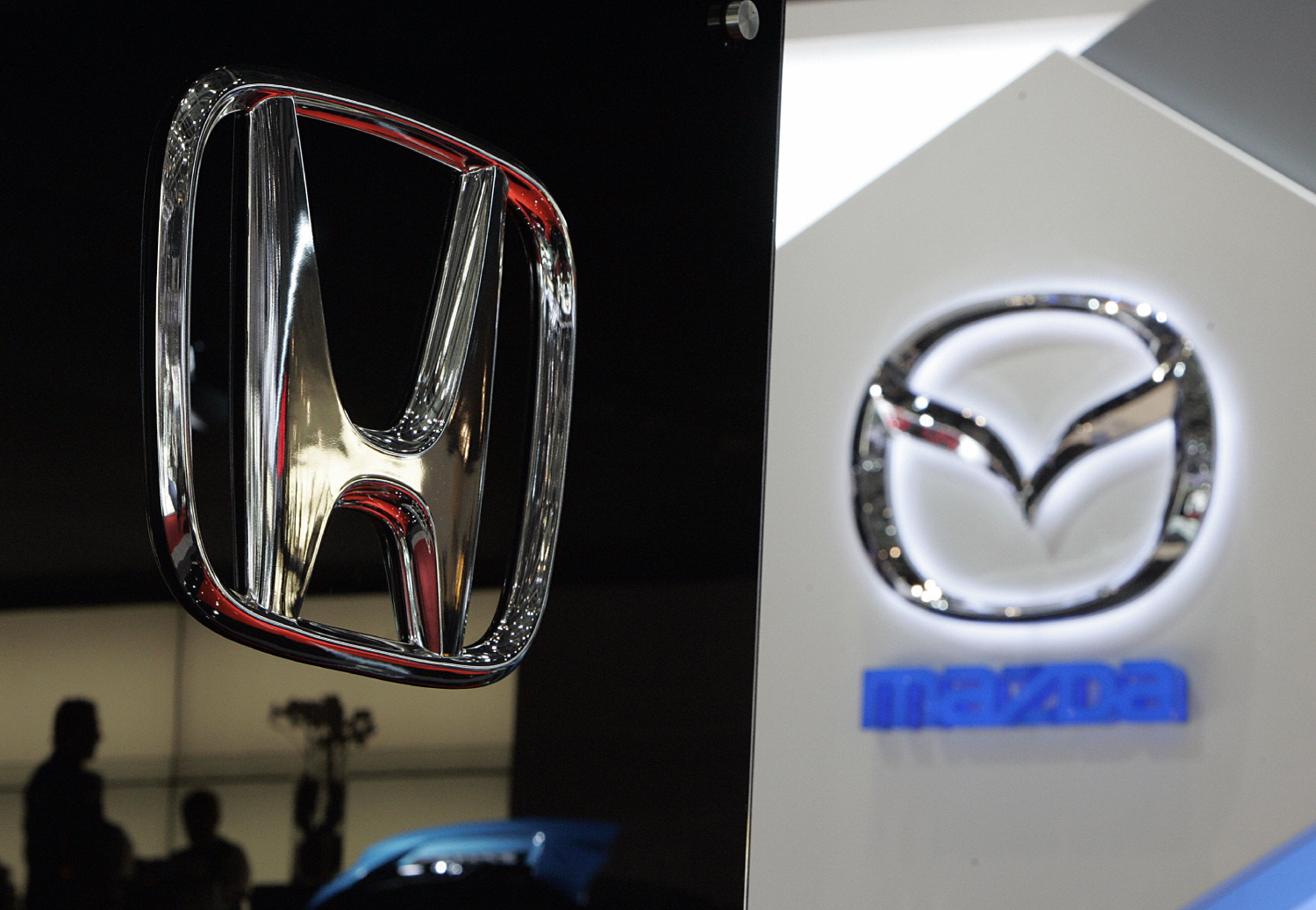 Honda and Mazda logos on display