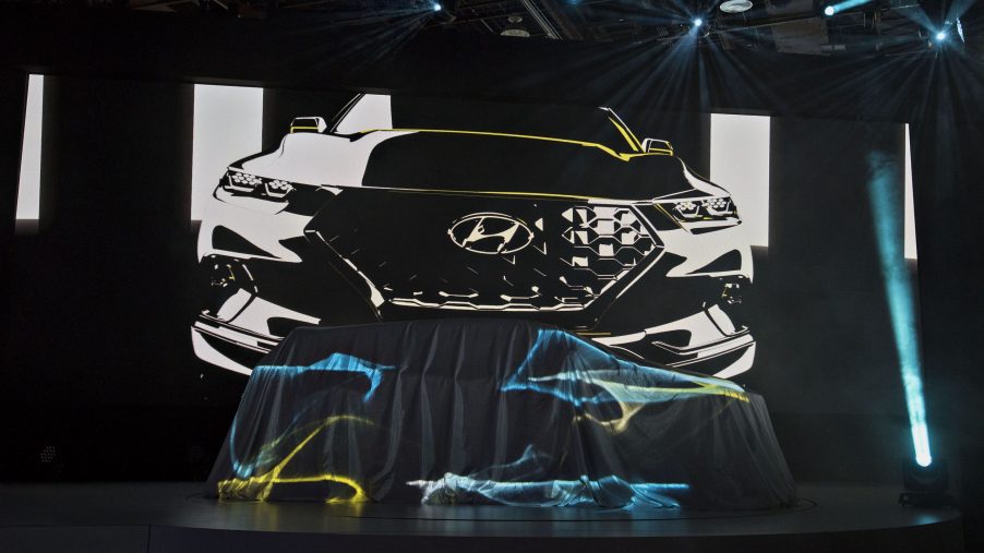 A Hyundai Motor Co. Santa Cruz Concept vehicle sits under a sheet prior to its unveiling during the 2015 North American International Auto Show