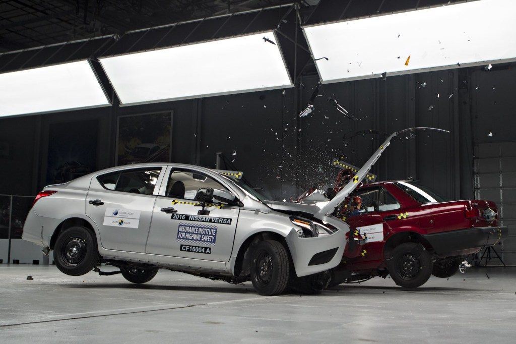 A Nissan Versa being crash tested by the IIHS