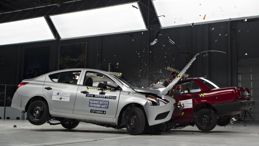 A Nissan Versa being crash tested by the IIHS