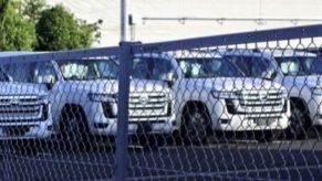An image of a Toyota Land Cruiser pictured outside of a factory.
