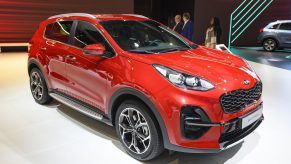 A red Kia Sportage compact SUV on display at Brussels Expo