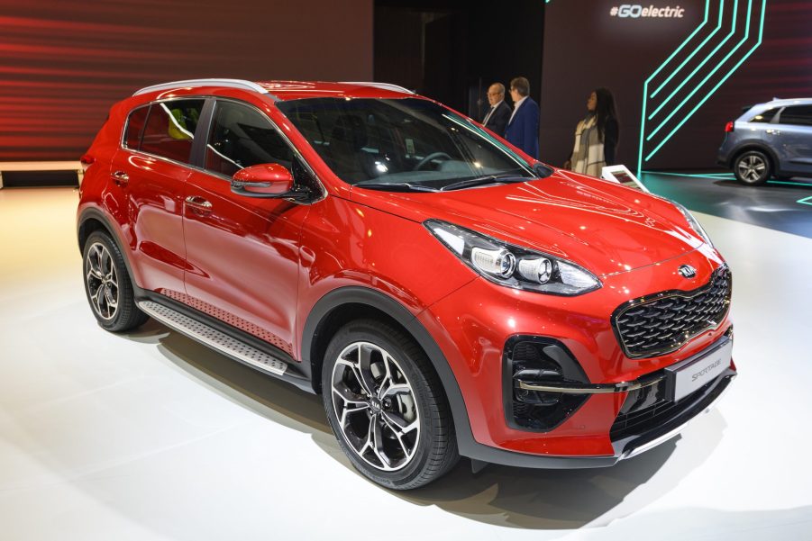 A red Kia Sportage compact SUV on display at Brussels Expo