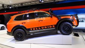 Orange Kia Telluride with roof rack seen at the New York International Auto Show at the Jacob K. Javits Convention Center in New York