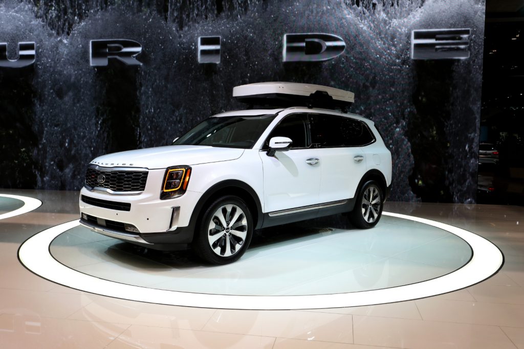 A white Kia Telluride sits on display at an auto show