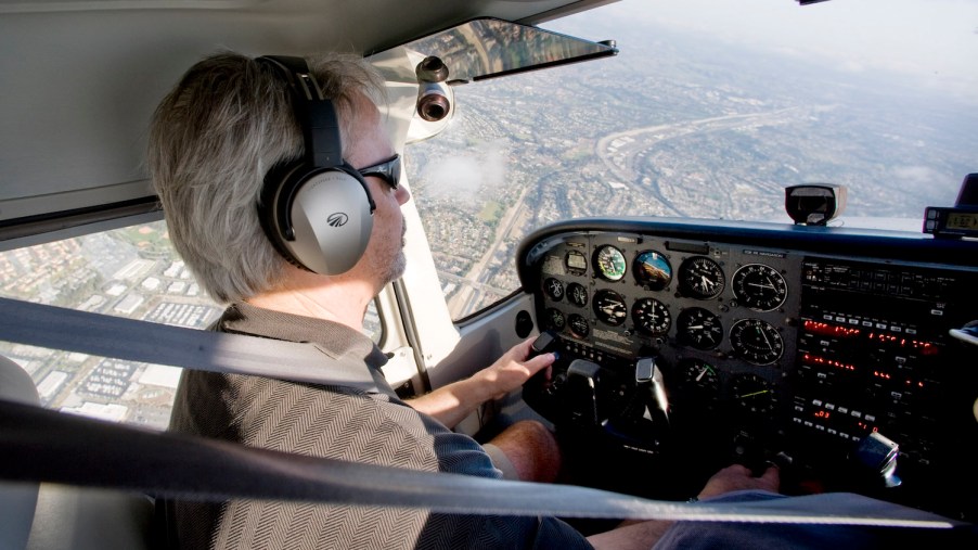A man flying a Cessna plane over California