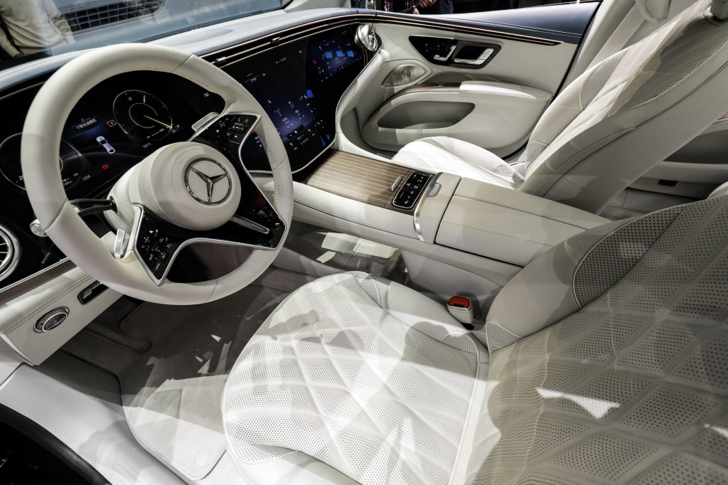 The white steering wheel of a Mercedes-Benz AG EQS electric sedan at the Auto Shanghai 2021 show