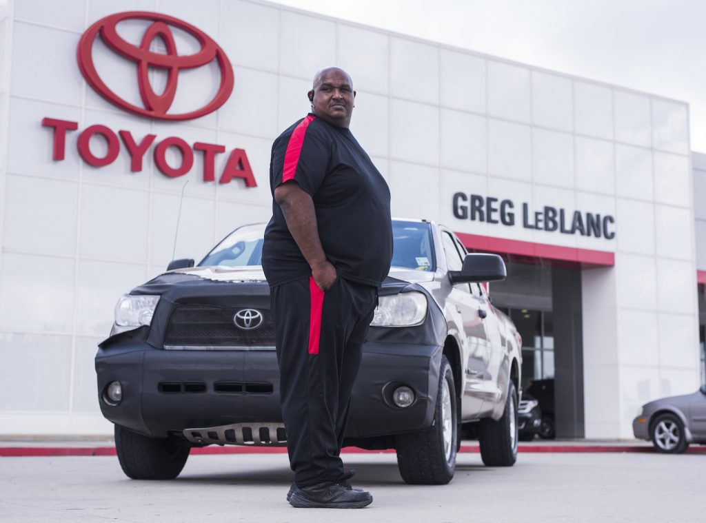 Victor Sheppard  pictured with his Toyota Tundra pickup in front of a Toyota dealership.