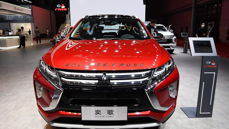 A red Mitsubishi Eclipse Cross car is displayed during the 19th Shanghai International Automobile Industry Exhibition
