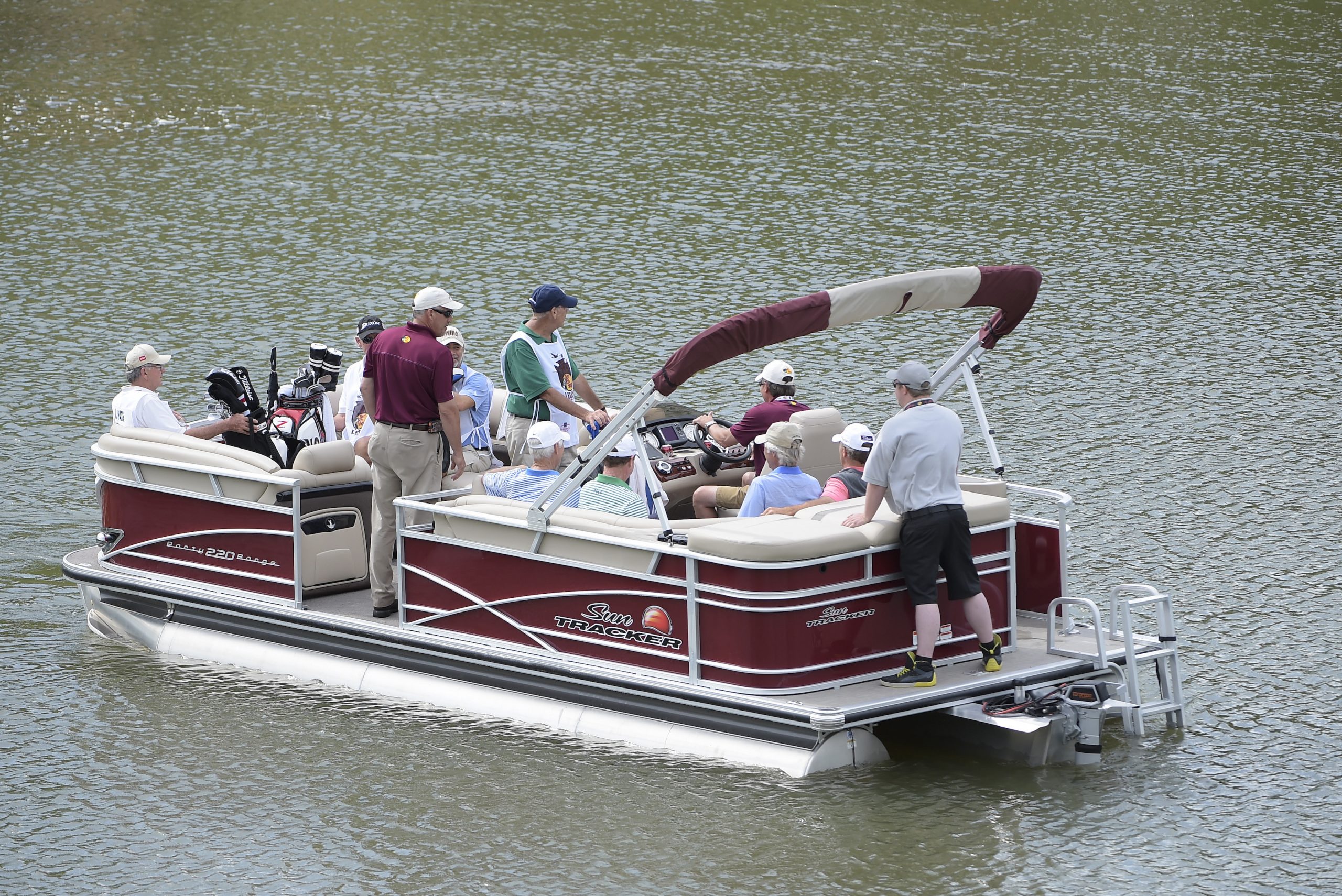 A red pontoon boat is used to ferry players to the 6th green during the first round of the Big Cedar Lodge Legends of Golf presented by Bass Pro Shops at Top of the Rock