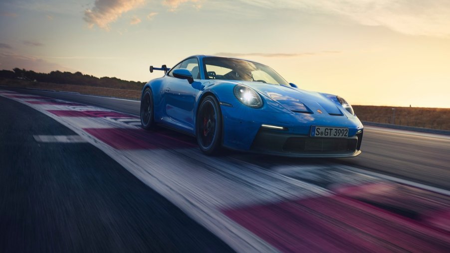 An image of a blue 2022 Porsche 911 GT3 on a track.