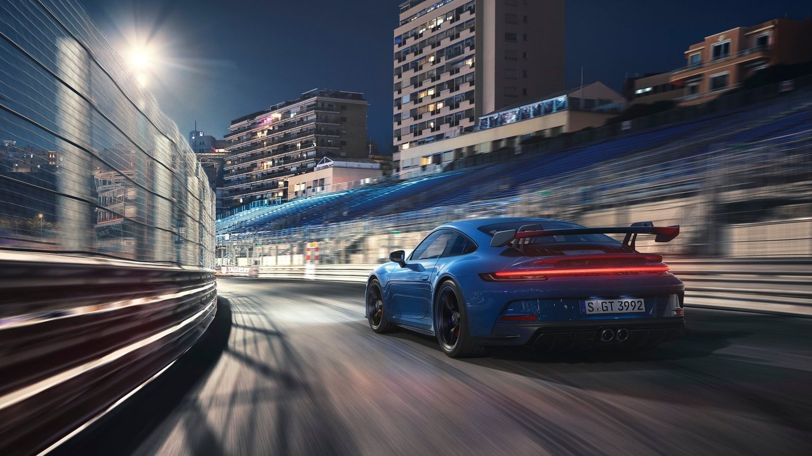 An image of a blue 2022 Porsche 911 GT3 on a track.