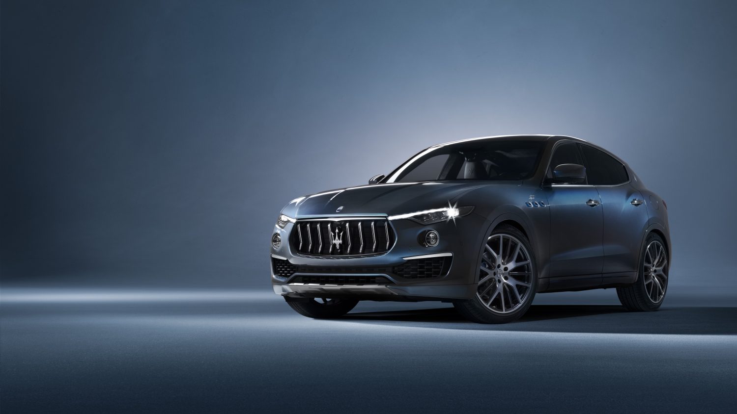 An image of a Maserati Levante Hybrid parked in a studio.