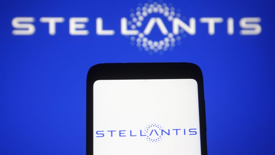 In this photo illustration a Stellantis logo of a multinational automotive manufacturer is seen on a smartphone