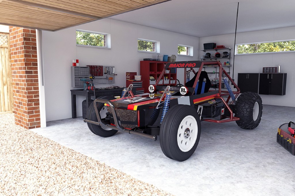 The black-and-red Tamiya Wild One MAX parked in a garage