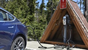 A Tesla electric vehicle plugged in for a charge