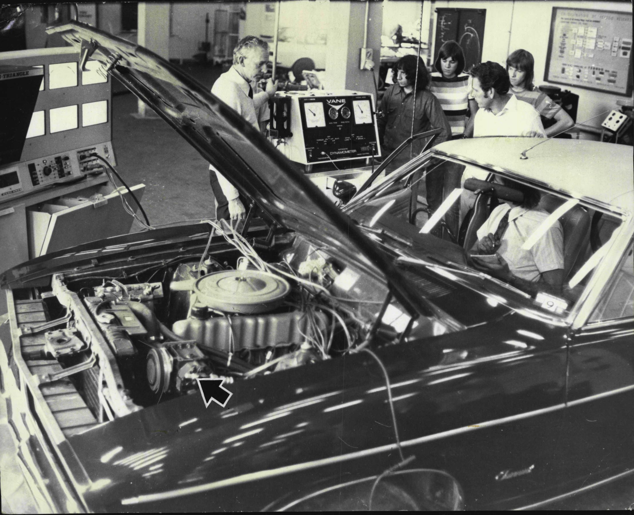 Testing the horsepower draw of the A/C (arrow-indicated) a 1975 Australian-market Ford Fairmont on a dynamometer