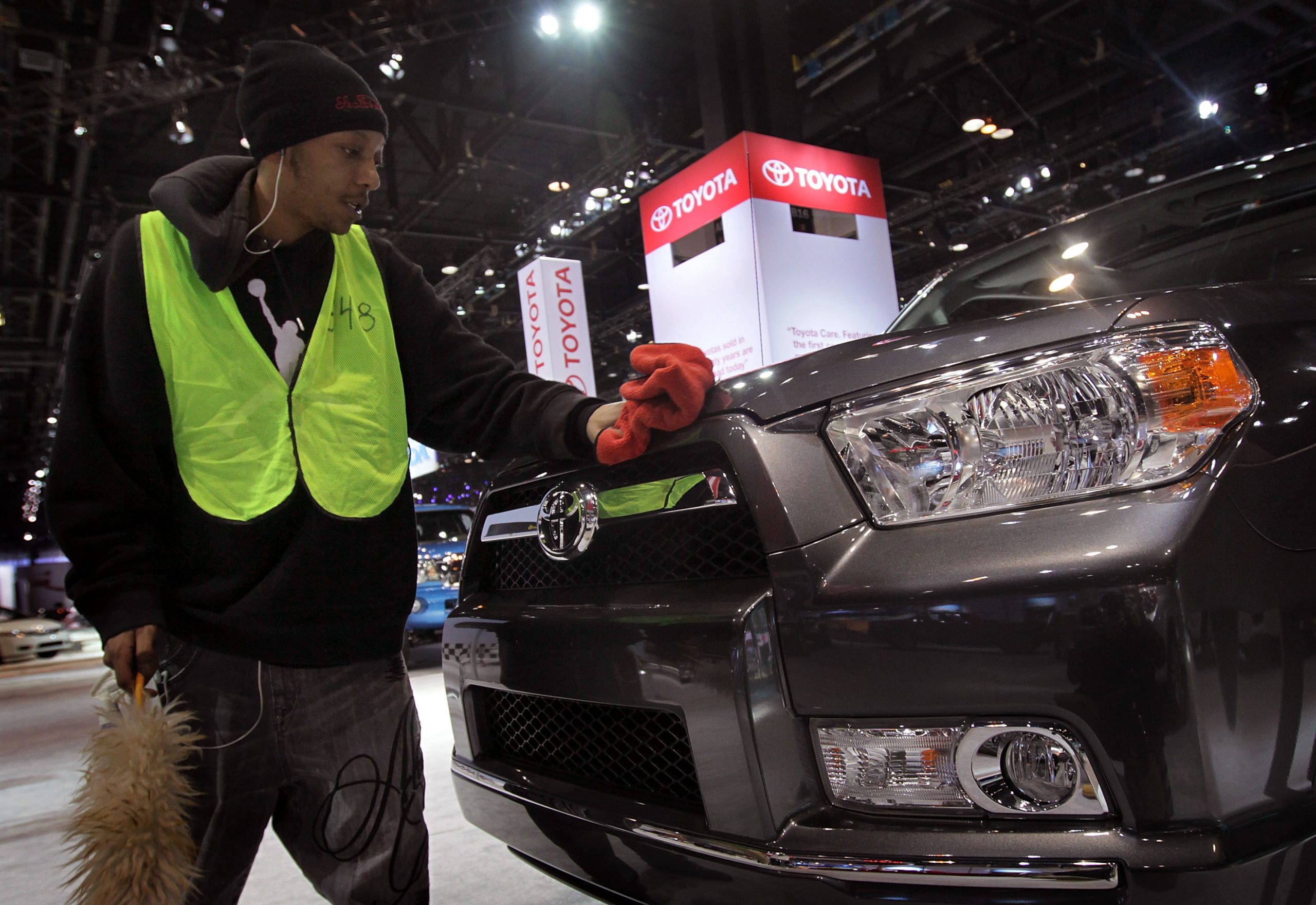 Tommie Rodgers prepares a Toyota 4Runner for display at the Chicago Auto Show on February 8, 2011