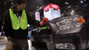 Tommie Rodgers prepares a Toyota 4Runner for display at the Chicago Auto Show on February 8, 2011