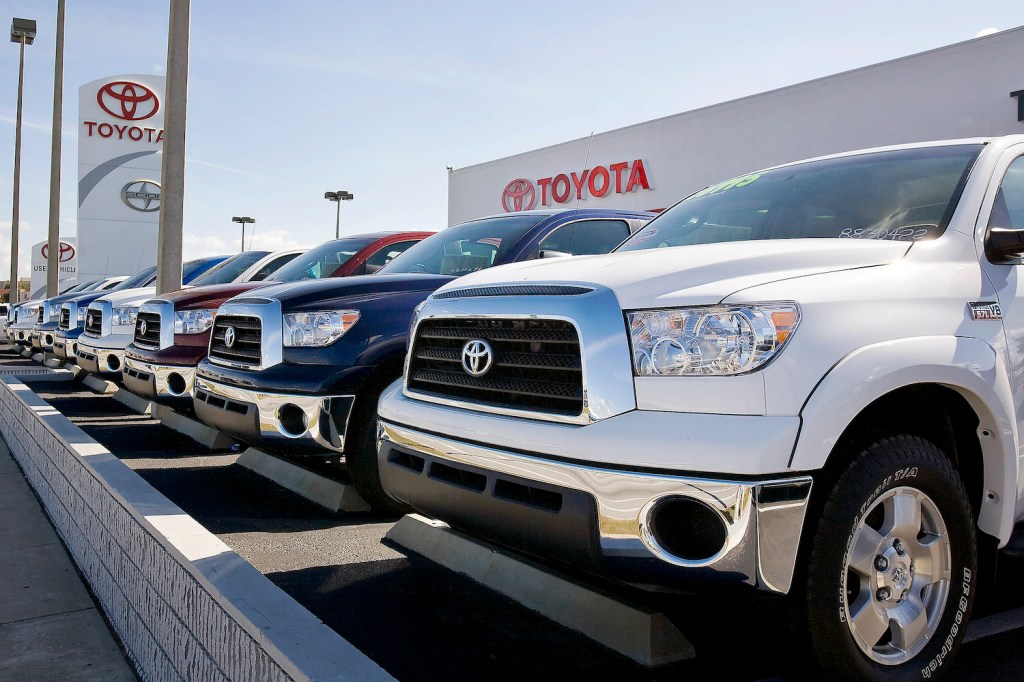 A lineup of Toyota Tundra full-size pickup trucks at a dealership