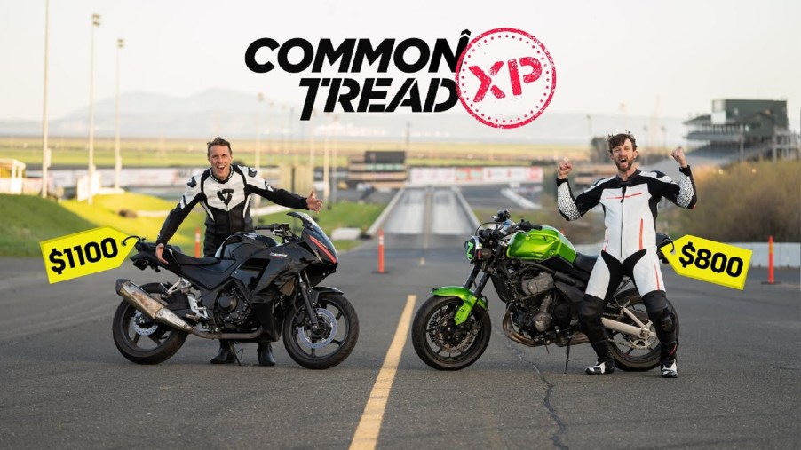 A used black 2015 Honda CBR300R next to a used green 2009 Kawasaki Versys 650 with the Common Tread hosts on a racetrack