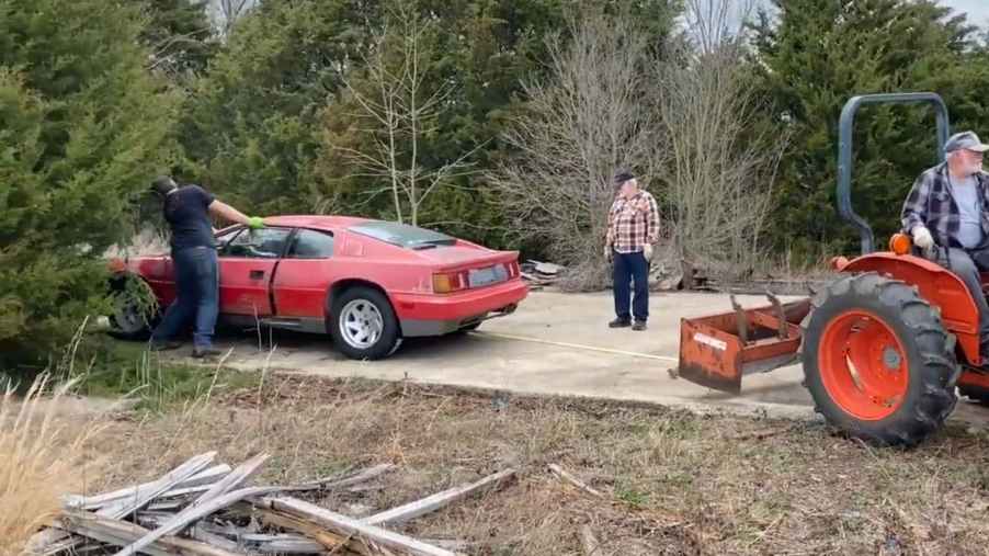 a 1988 Lotus Esprit barn find getting pulled out of a field