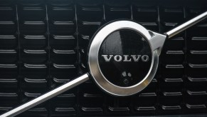 A silver Volvo logo is seen on the black grille of a parked car on Tuesday, January 11, 2021