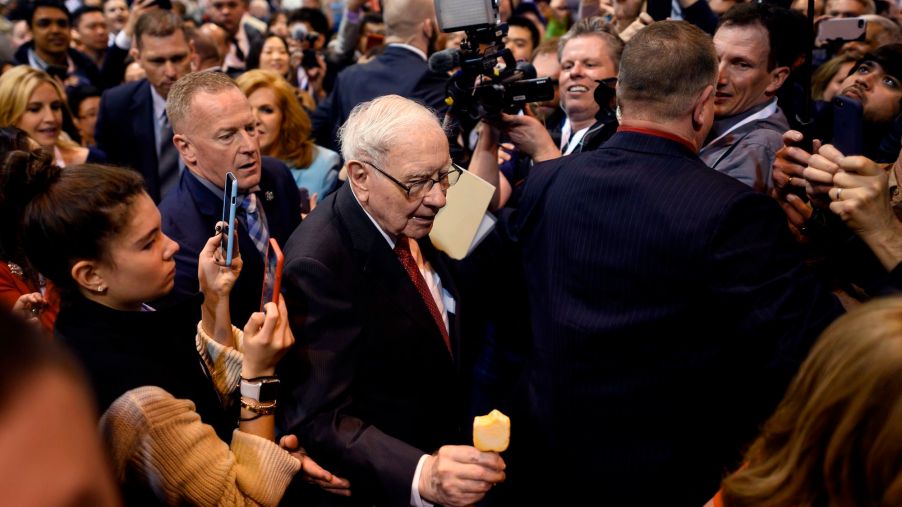 Warren Buffett (center), CEO of Berkshire Hathaway, is surrounded by press and fans as he arrives at the 2019 annual shareholders meeting in Omaha, Nebraska, on May 4, 2019