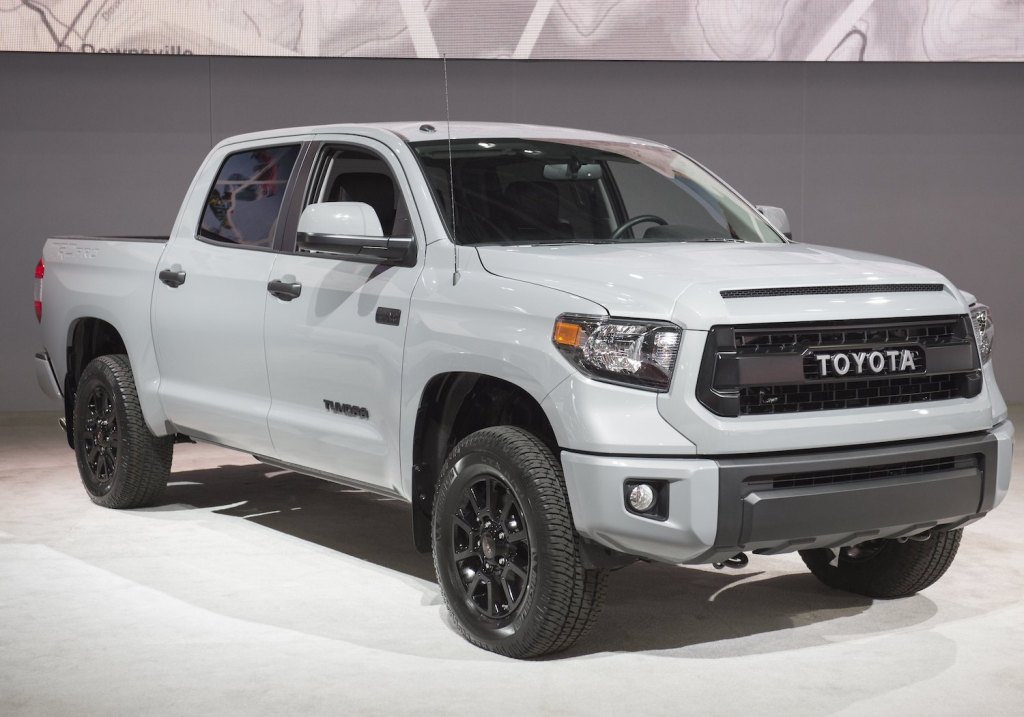 A white Toyota Tundra parked at an auto show.
